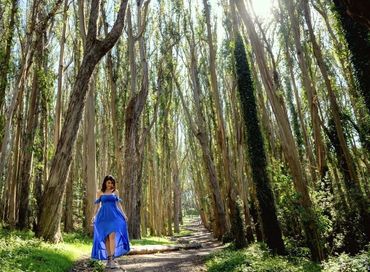 Woman in blue dress in forest